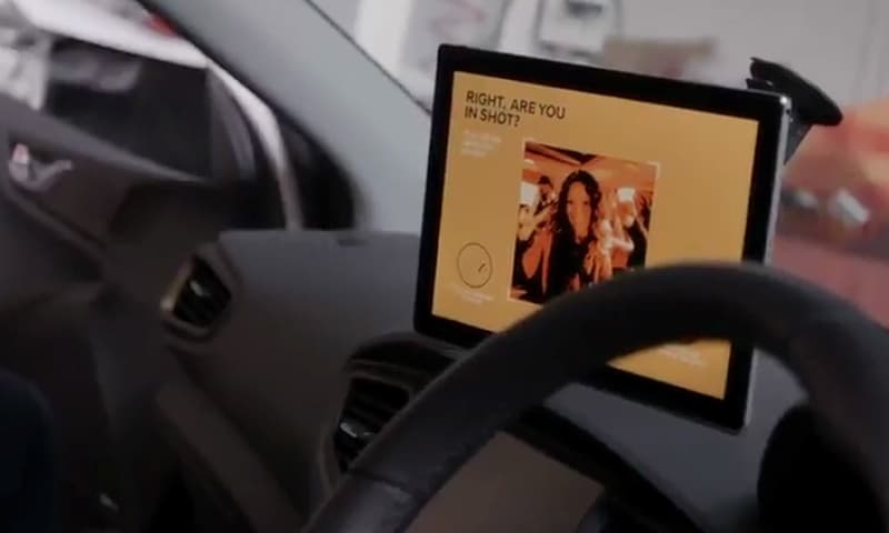 Photo of a pitch-side official updating scores using their tablet app