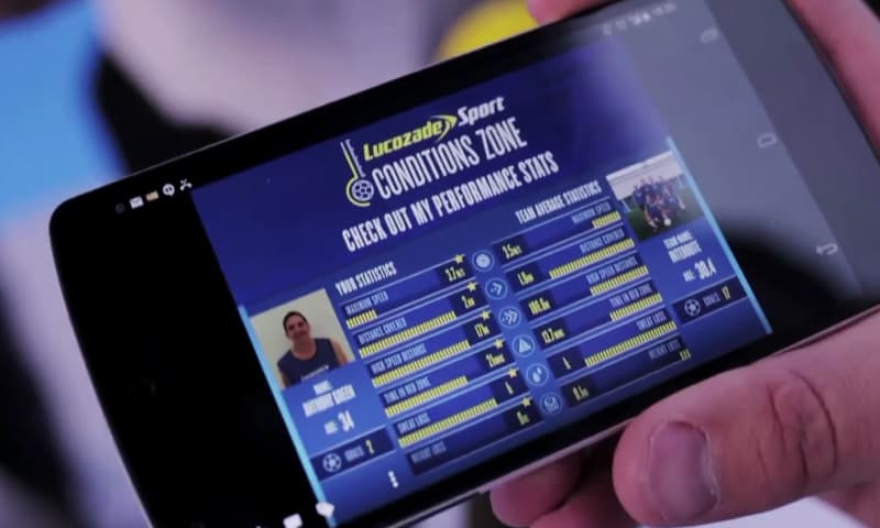 Photo of a player showing their stats on a mobile device after a match